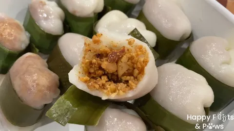 Glutinous Rice Balls with nuts inside wrapped with banana leaves