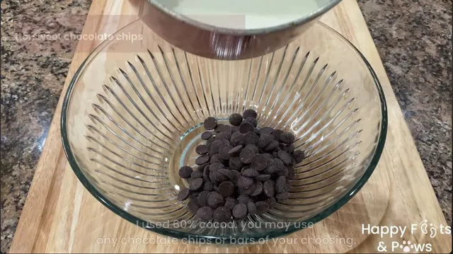 Pouring the hot heavy whipping cream into a bowl with bitter-sweet chocolate chips