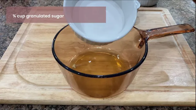 Adding the ingredients to a glassware that is stove top safe for Swiss Meringue