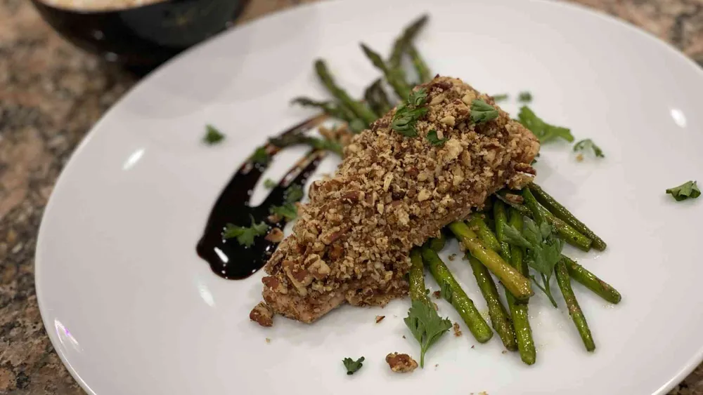 Pecan Crusted Mahi Mahi on plate with asparagus