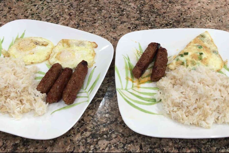 Two plates of rice with eggs Filipino Longanisa and eggs cooked.