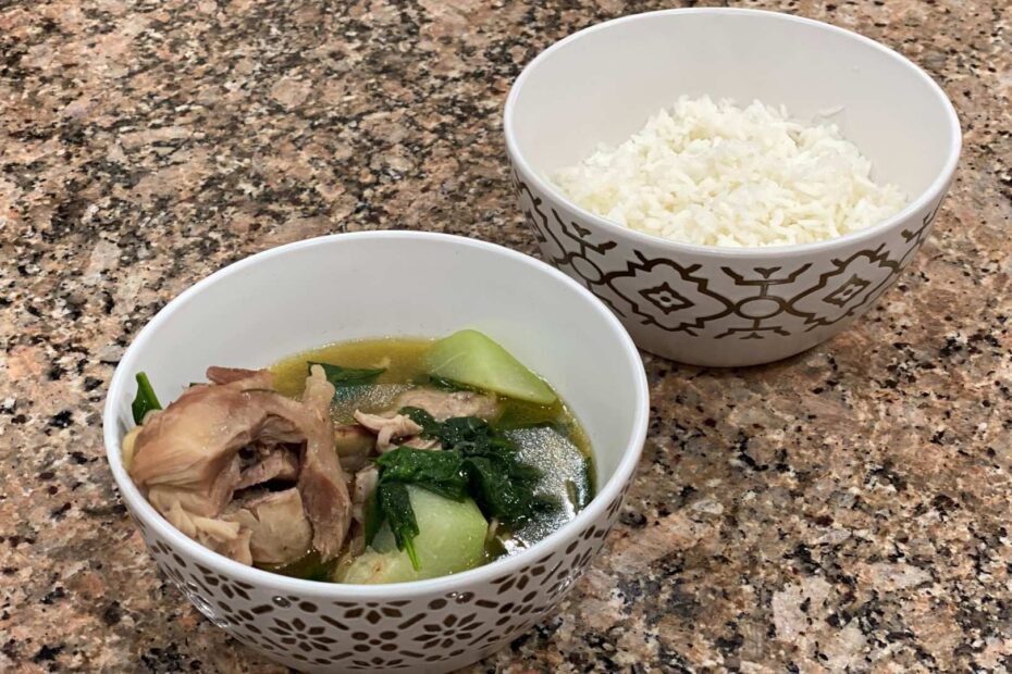A bowl of Tinolang Manok with white rice on the side