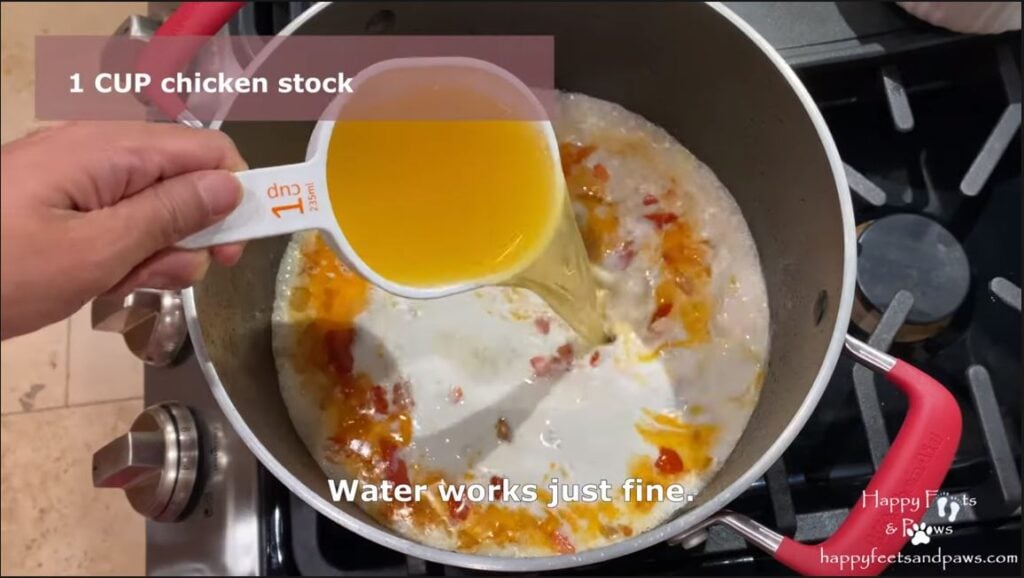 pouring chicken stock into ginataang isda