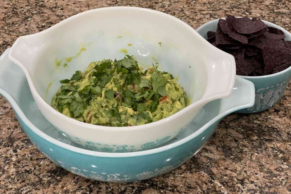 home made guacamole in a bowl with chips