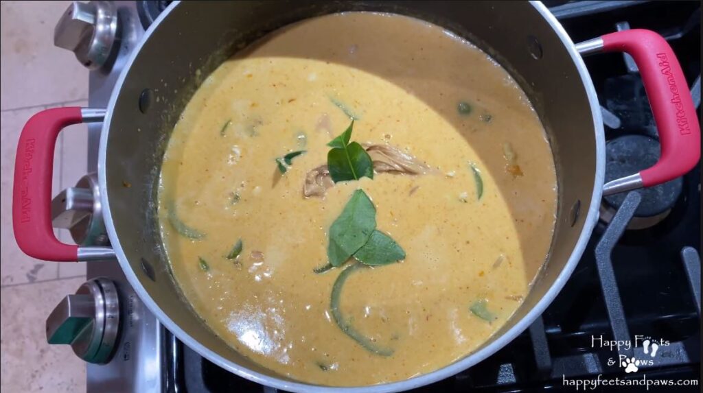 kaffir lime leaves in a pot of panang curry