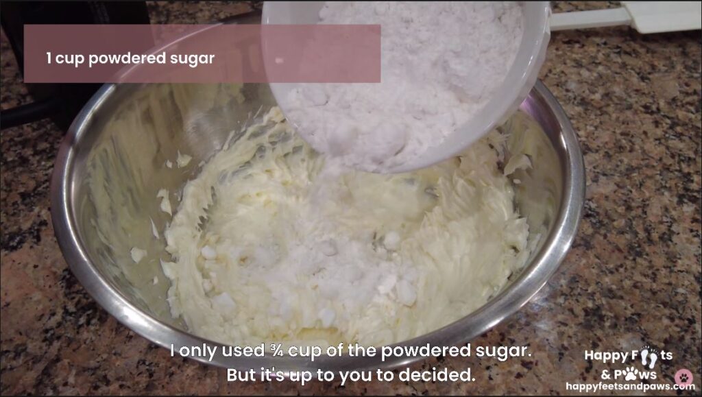 cream cheese frosting being mixed in a bowl