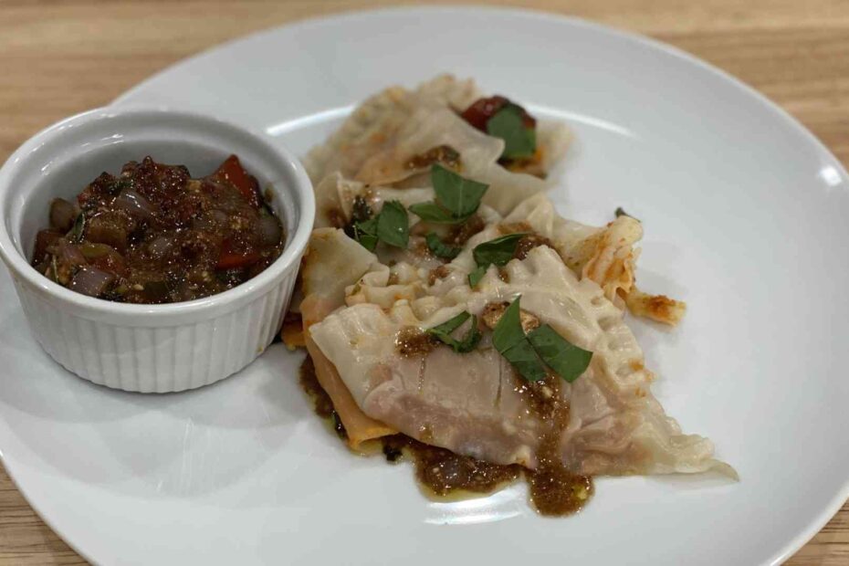 White Bean and Sun-Dried Tomato Ravioli with Tomato and Feta Cheese Sauce on a plate