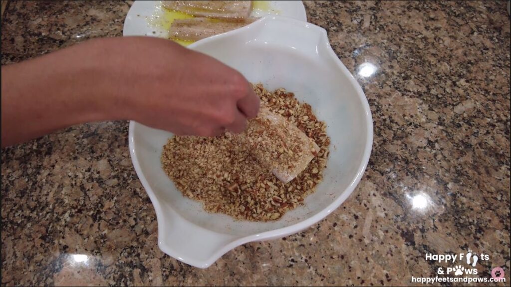 breading mahi mahi fish in bowl