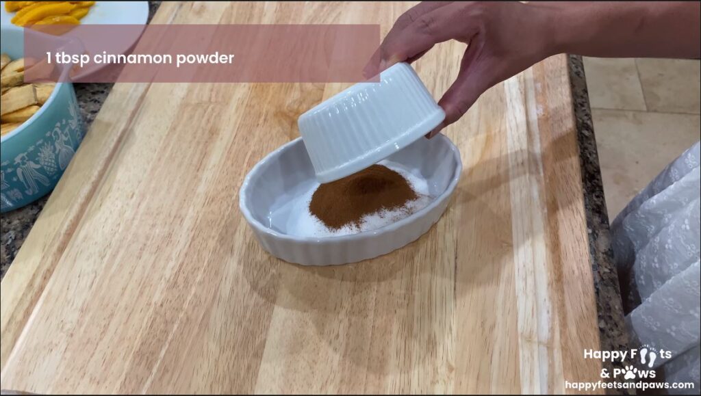 mixing sugar and cinnamon in a bowl for Banana Rum Rolls