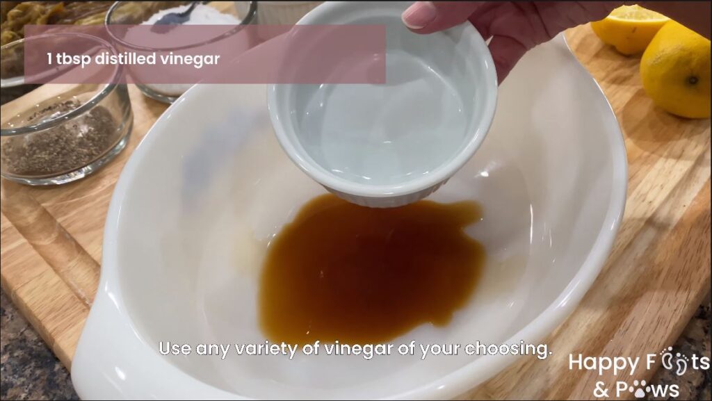 adding distilled vinegar to filipino grilled eggplant salad