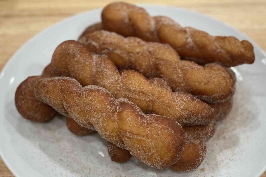 shakoy or Filipino donuts on a plate stacked