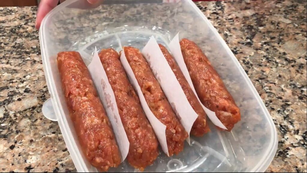 skinless longanisa stored in a container with paper in between
