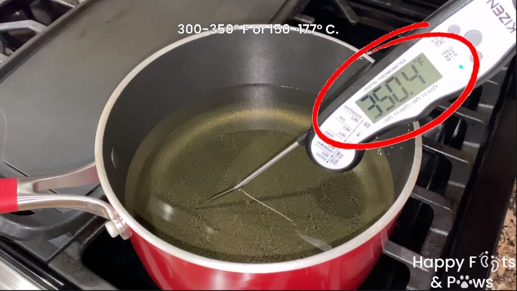 heated oil in a pot to cook lumpia shanghai