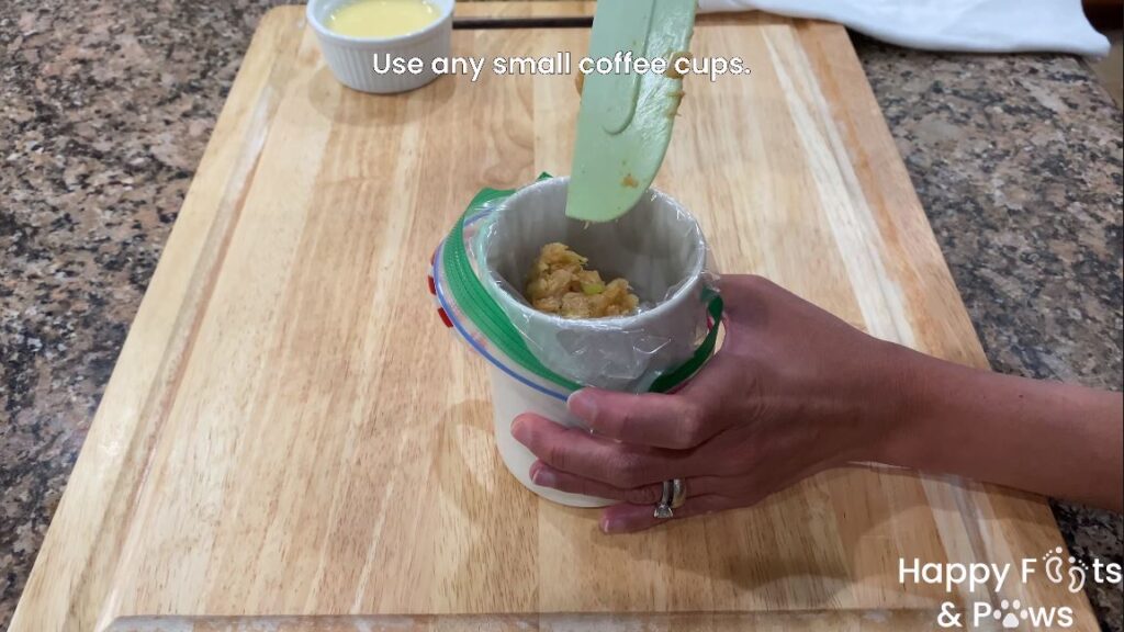 placing lumpia shanghai meat in cup