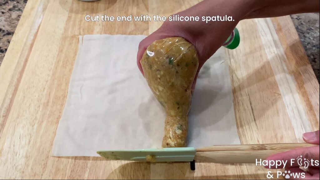 placing lumpia shanghai meat mix into a wrapper with a bag for no mess