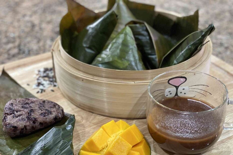 Filipino Puto Maya or Sticky Rice Cake with Sikwate on a cutting board