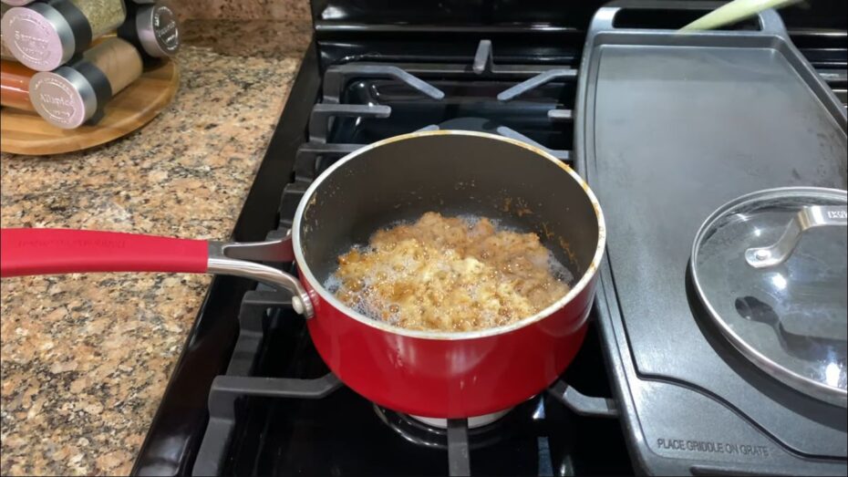 Gold brown coconut milk curds in a saucepan