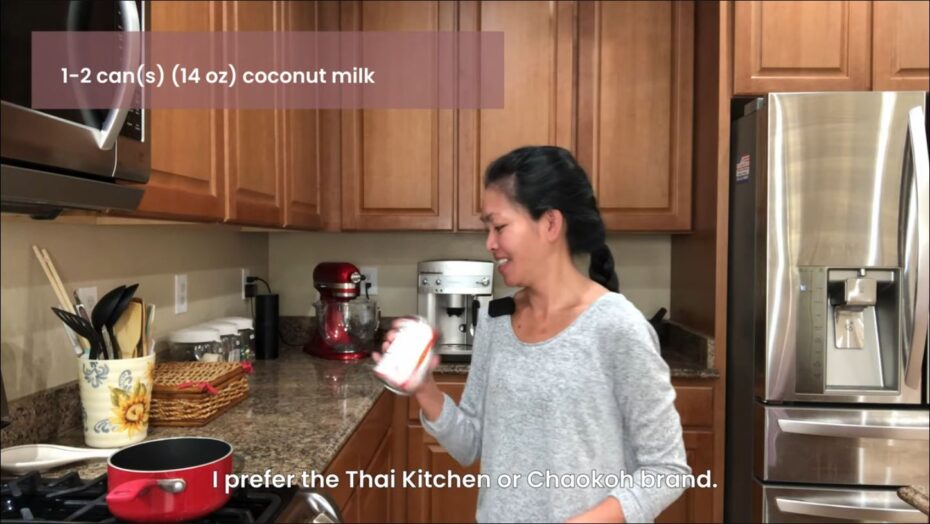 Shaking a can of coconut milk to mix well