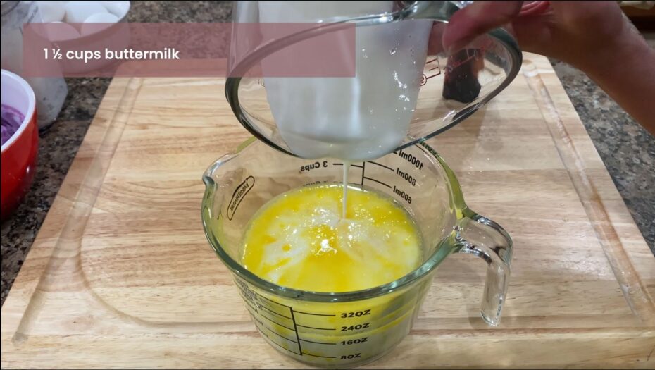 Adding wet ingredients into a measuring cup for Ube Cupcakes