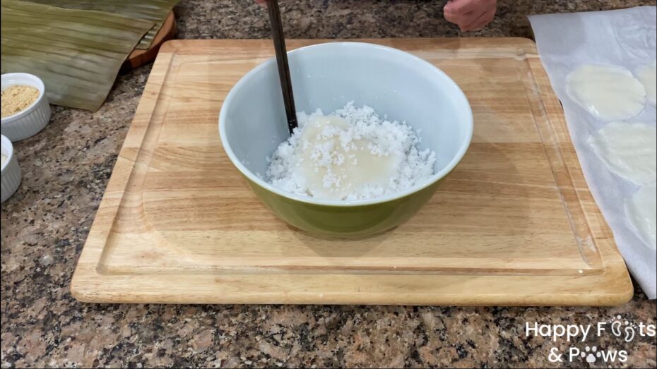 Coating the cooked dough with coconut flakes